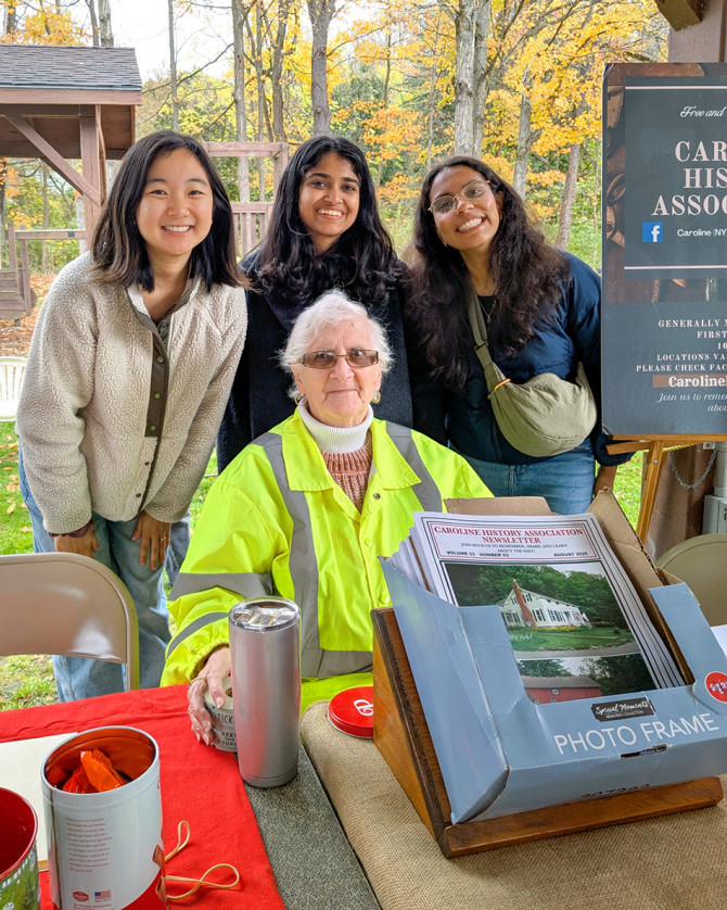 At center, Beth Harrington, president of the Slaterville Volunteer Fire Company in the Town of Caroline, visits with Cornell master’s degree students (left to right) Hannah Chow Russell ’19, Shreya Rangaraj and Kritika Vidyashankar.