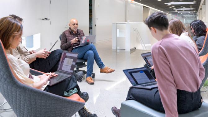 Ashwini Chhabra (center), director of the Urban Innovation Fellows Initiative, moved from corporate law to city government early in his own career.  