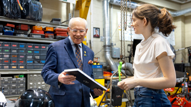 Tonko looks over materials with Jolene Gagliano ’26.