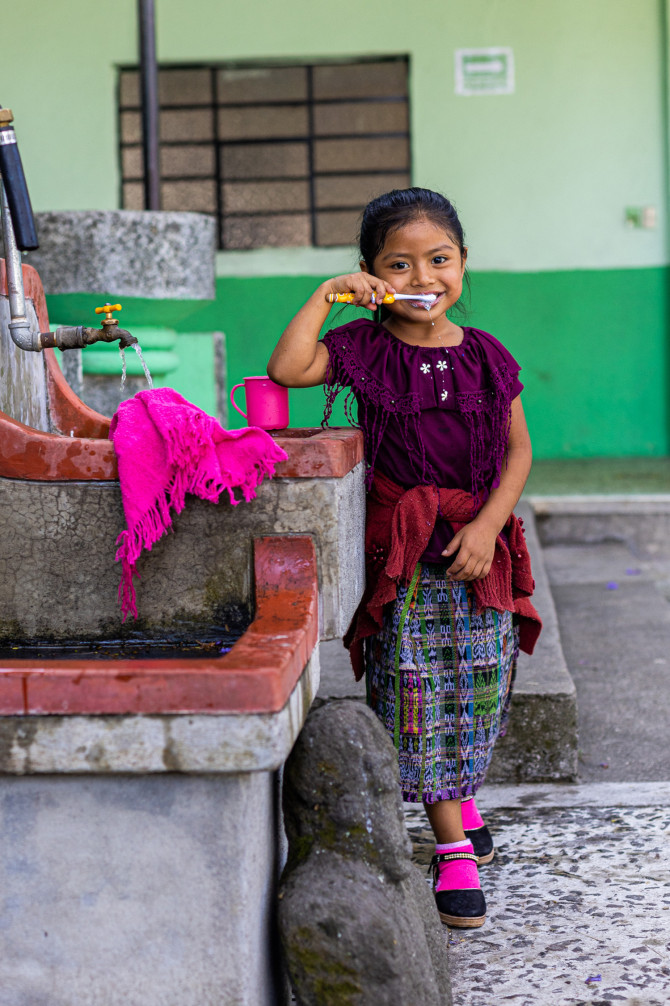 girl brushing her teeth