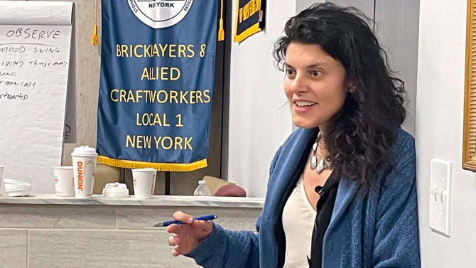 Arianna Schindle, director of training and curriculum design at the Worker Institute and a licensed therapist, offers feedback to peer supporter trainees.