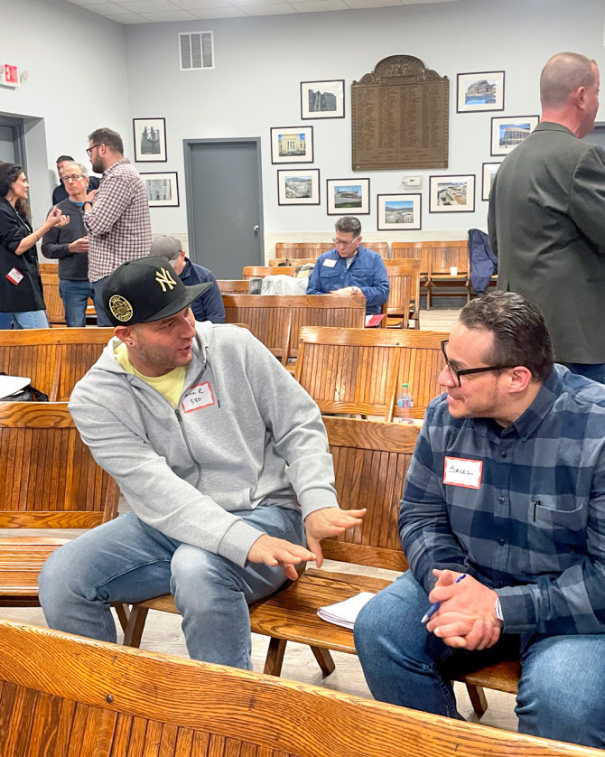 Two union members do a role play during a peer-supporter training at the Bricklayers and Allied Craftworkers Union Local 1, in Long Island City, New York.