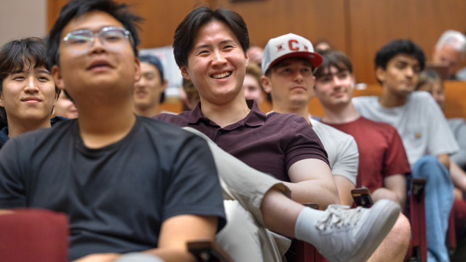 The audience enjoys Johnson’s comments.