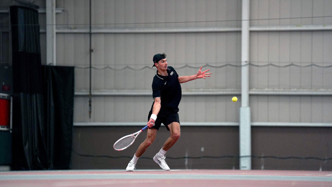 Eric Verdes '27 prepares to hit a shot during his match at No. 2 singles during the Big Red's 4-3 victory over Columbia.