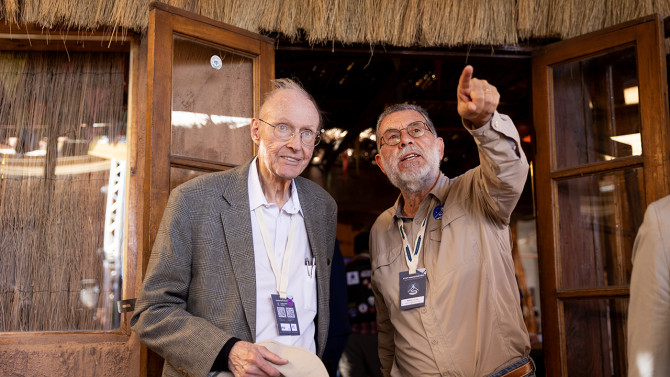 At left, Fred Young ’64, M.Eng ’66, MBA ’66, who has supported FYST since the project’s early days, talks with Pedro Correa, project manager of the Fred Young Submillimeter Telescope.