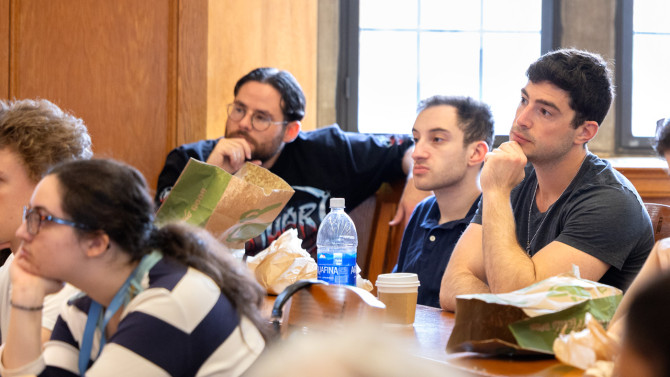 Audience members attend the discussion