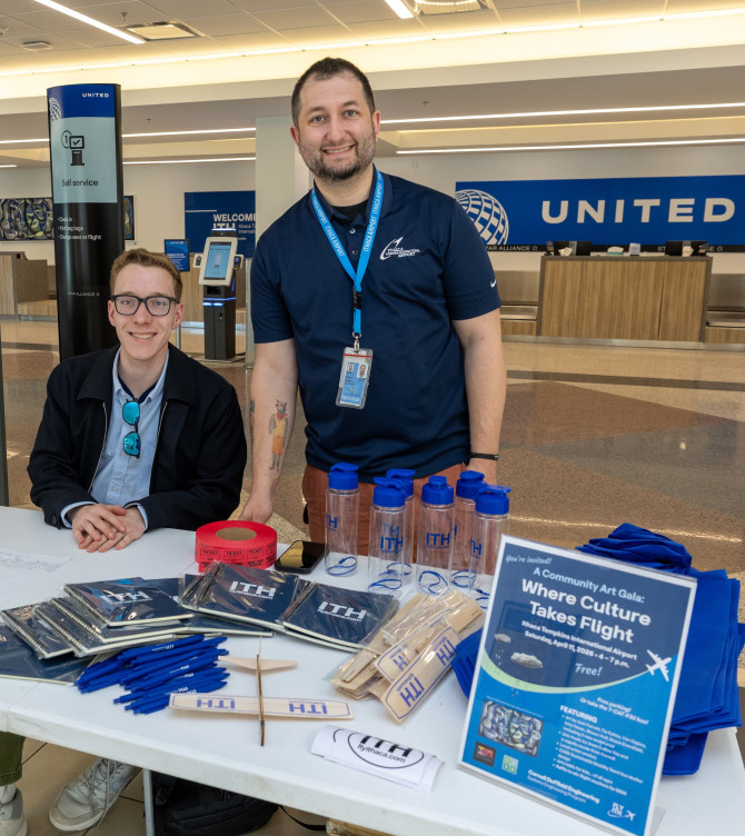 two people at an information table