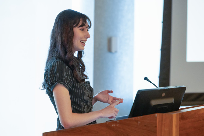 student stands at podium