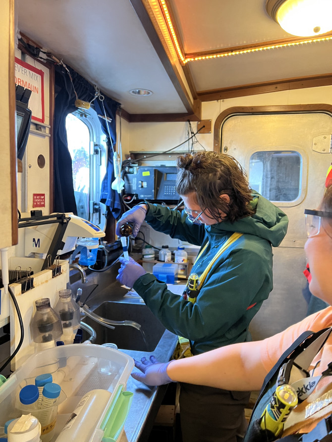 Ana Hoffman Sole works in the laboratory space of the ship. 