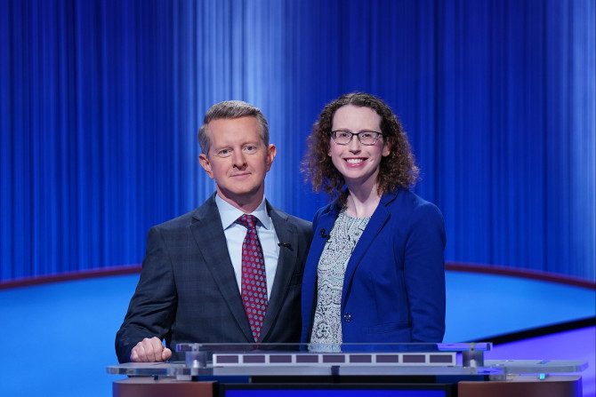 two people on a game show stage