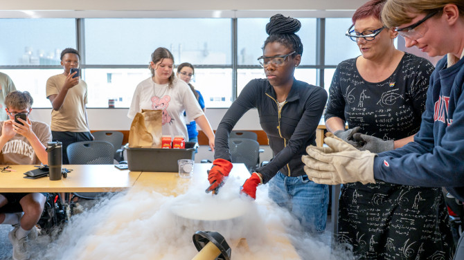 4-H’ers use liquid nitrogen to make ice cream in the session “Exploring the Universe: From Planets to Supernovae.”