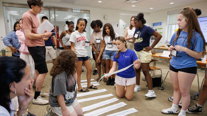 Participants in the Youth Investigators program work together to structure interview questions.