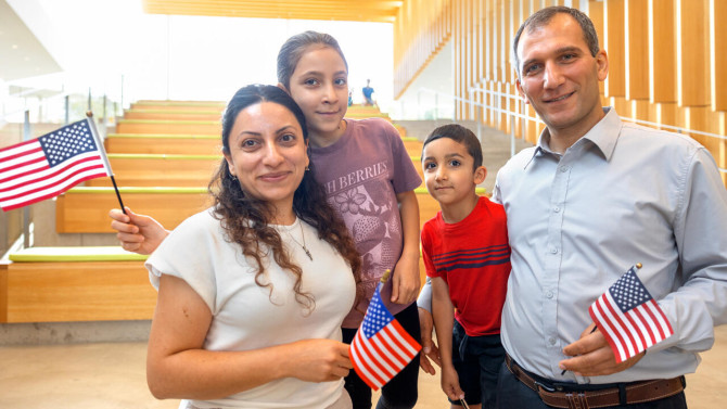 Lilit Abrahayan (left) and her husband, Vardan Khachatryan (right), became U.S. citizens at a naturalization ceremony held July 23 at the College of Veterinary Medicine. Their two children are pictured between them. Khachatryan is a research associate at the Cornell Laboratory for Accelerator-based ScienceS and Education (CLASSE).