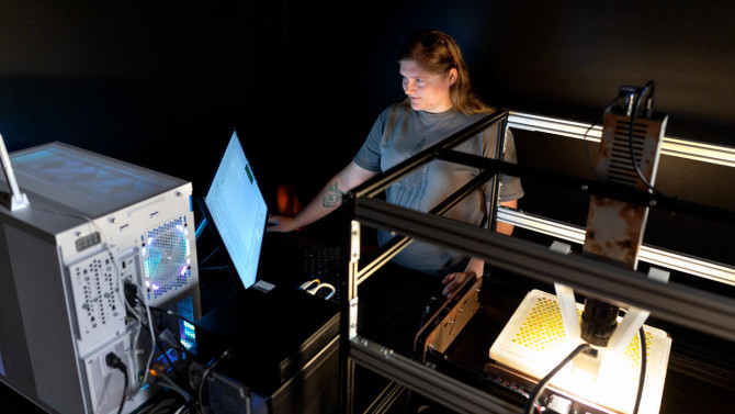 Doctoral student Aliyah Brewer works with the HyperBird spectroscopy machine in a lab at Cornell AgriTech in Geneva, New York.