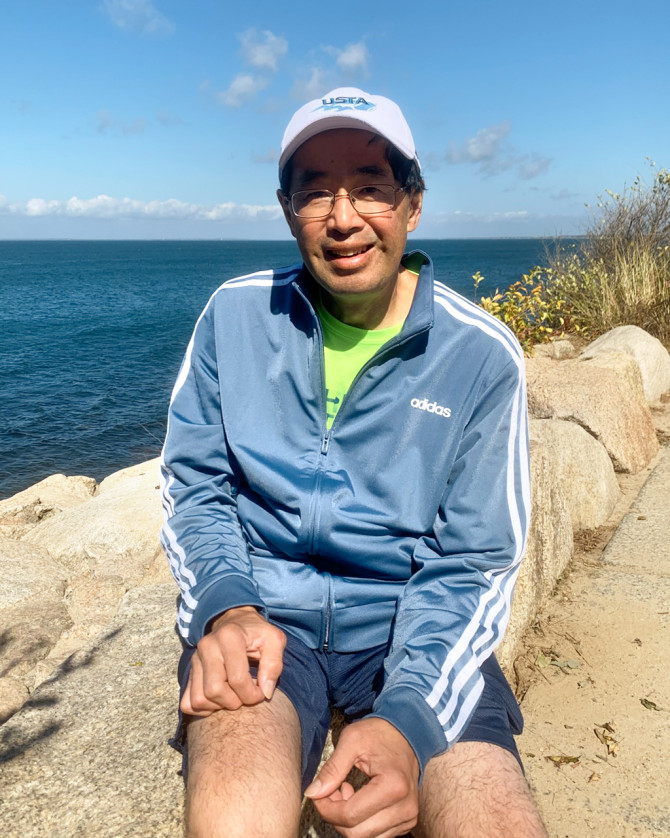 Stan Au, shown here in August 2022, has resumed several activities including hiking and pickleball after treatments.