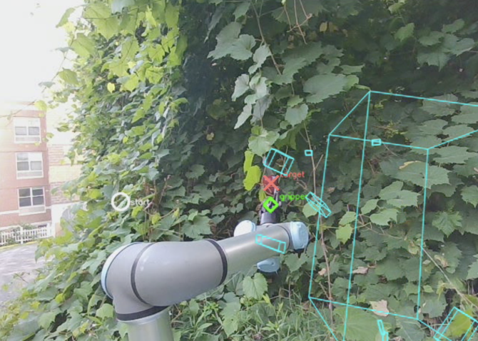robotic arm grabs an apple