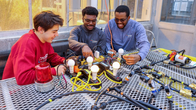 CROPPS trainees and undergraduate researchers Bobby Henkelmann, Daniel Baldeo-Thorne and Muna Nwaiwu program a closed-loop fertigation system.