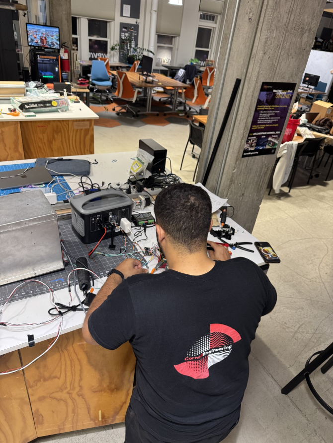 student at a tech workstation