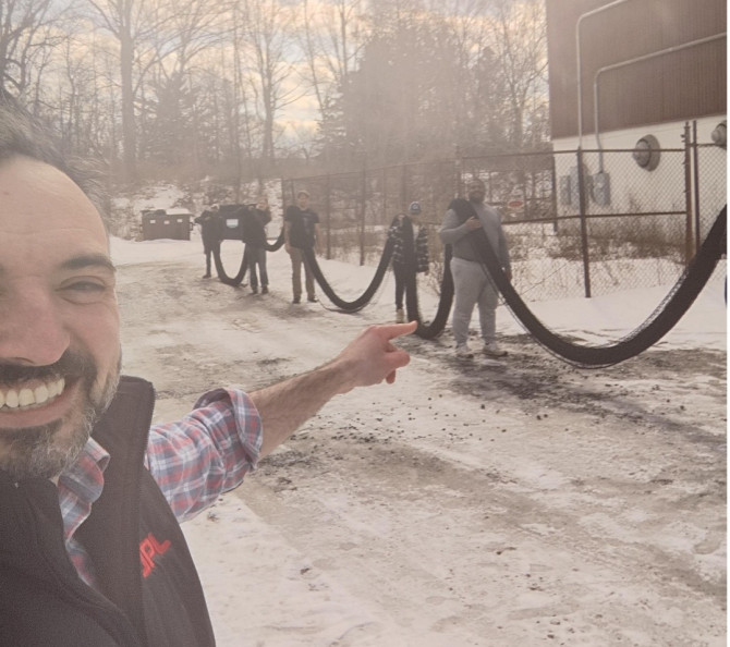 professor points to five students carrying a net