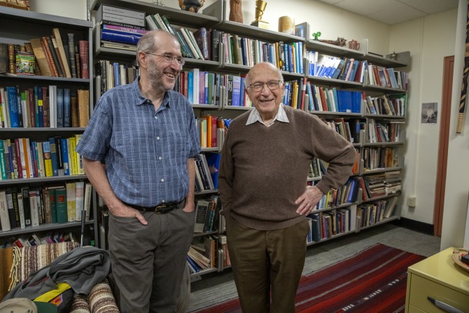 Fearn, left and Hoffmann reconnect in Hoffmann's office in 2024