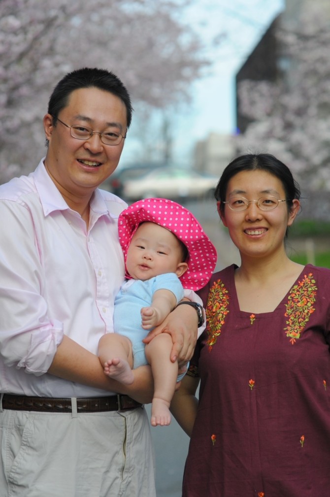 Mao Ye, Ph.D. '11 (above, holding daughter Cornelia at 7 months, with wife Xi Yang, Ph.D. ’10