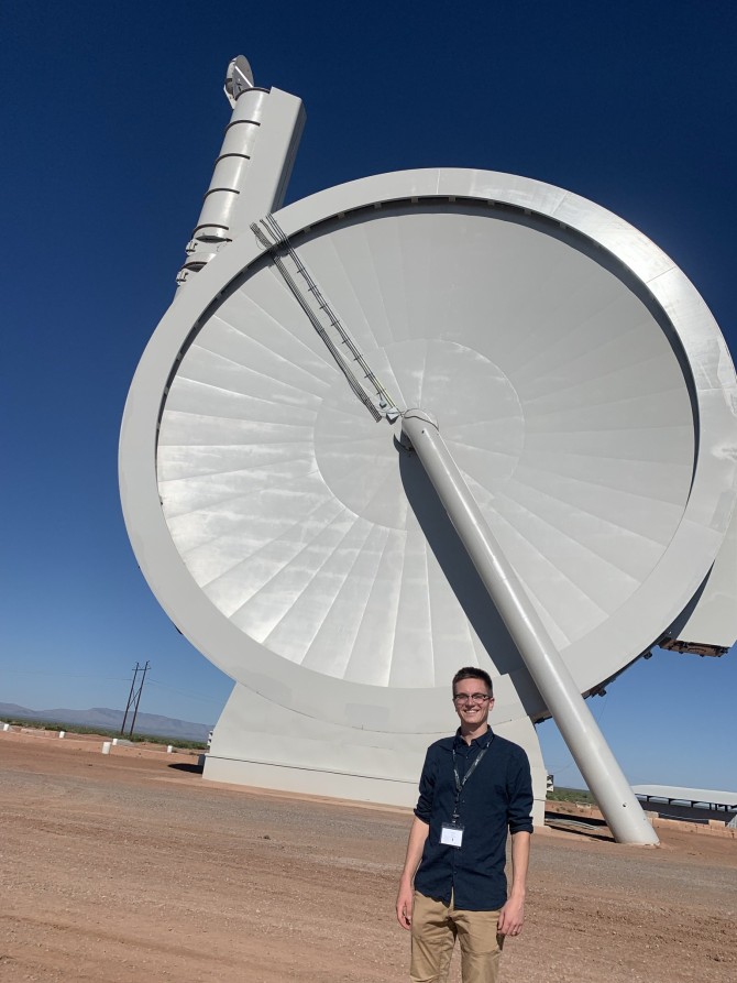 Hunter Adams stands in front of Suborbital Accelerator