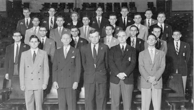 23 men pose for a class photo