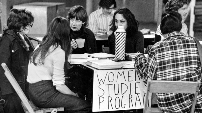 At center, Jennie Farley '54, M.S. '69, Ph.D. '70, professor of industrial and labor relations and co-founder of Cornell's Women's Studies program, talks with students in this photo from the 1970s. She directed the Women's Studies program 1972-76.