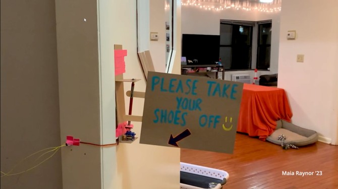 Mechanical sign reminding people to remove their shoes upon entering an apartment
