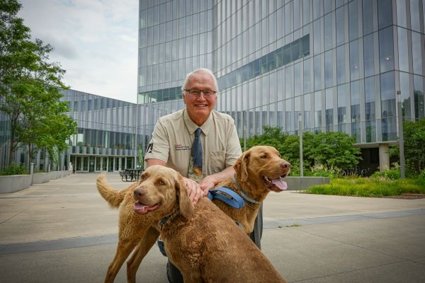 Dr. Rory Todhunter with two dogs