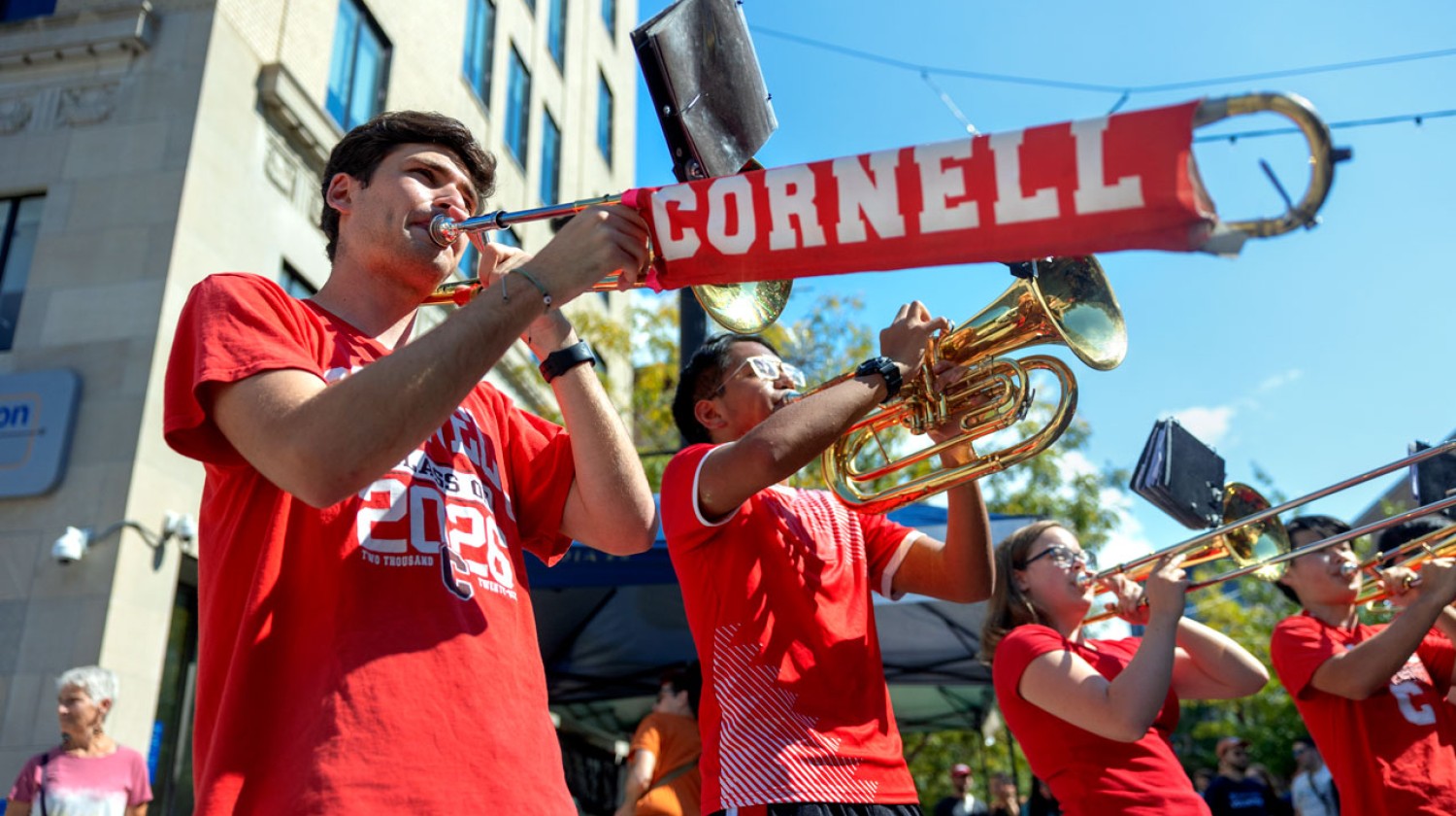 The horns section for the Big Red Band performs on the Commons.