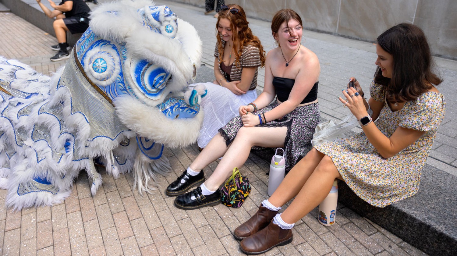 Students experience the Cornell Lion Dance performance. Lion dancing is a traditional Chinese ritual that is thought to bring good luck and drive away evil spirits.