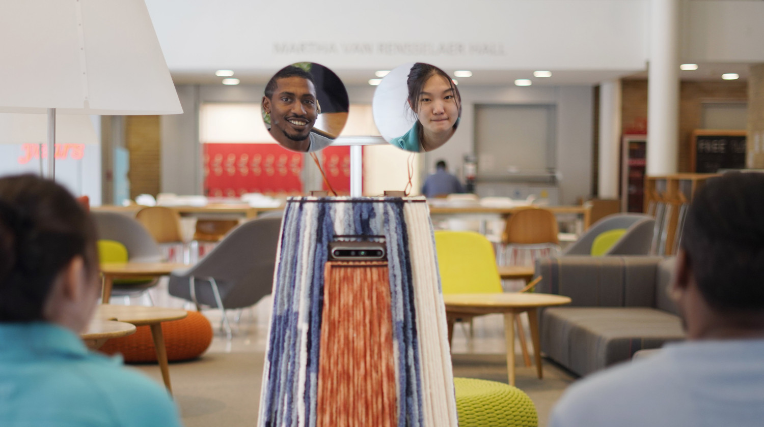 Two students shown to each other using MirrorBot