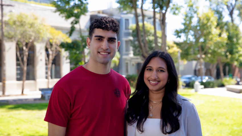 two people standing outside