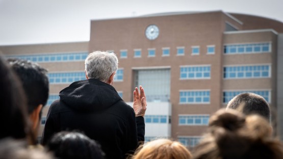 Bill Nye explains the workings of his solar noon clock on Rhodes Hall.