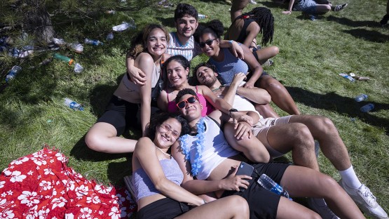 A group of friends laying in the grass on Libe Slope. 