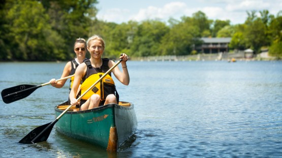 Students canoe around Beebe Lake with the help of the Cornell Outdoor Education program for Senior Days.