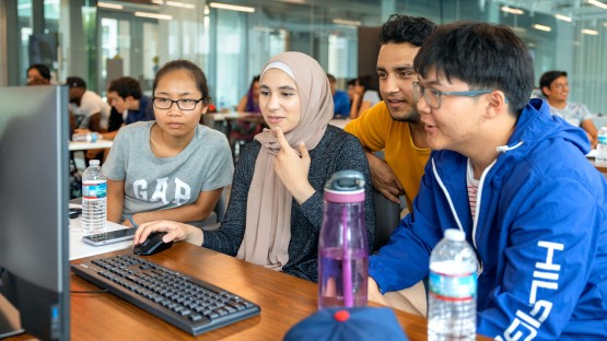 Students gathered at computer