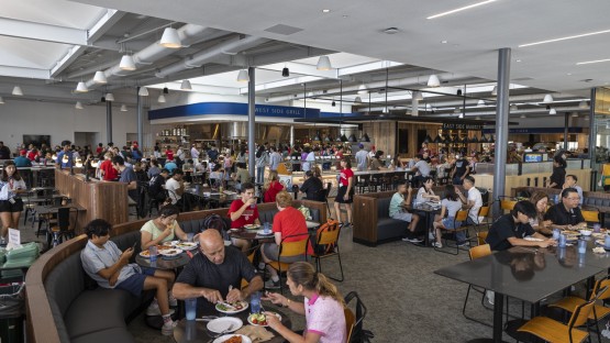 Students and their families grab lunch on move-in day in the Toni Morrison Dining Hall.