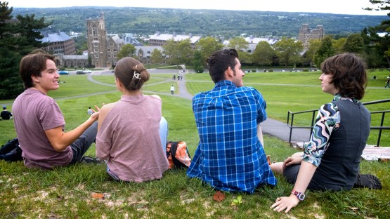 A group of students relax on Libe Slope