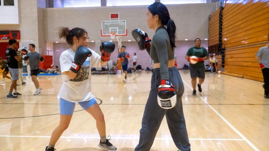 Students participating in an Intro to Boxing class in Bartels Hall.