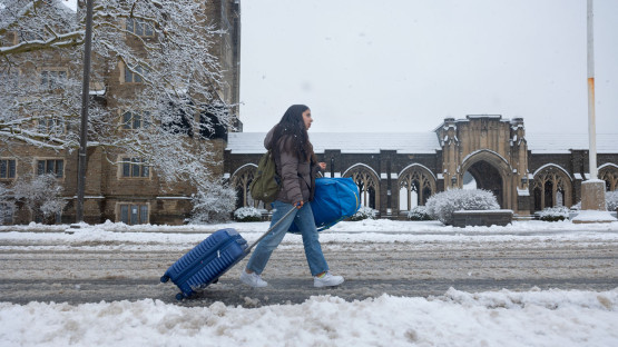 Students wait for the bus at the bottom of Libe Slope.