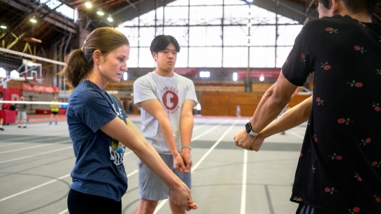 Volleyball class students get instruction in Barton Hall.