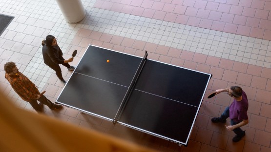 Students take a break with a game of ping pong in Biotech.