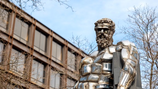 Herakles statue watches over comings and goings by Uris Hall. 