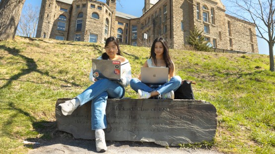 Students study on Libe Slope on a warm spring day.