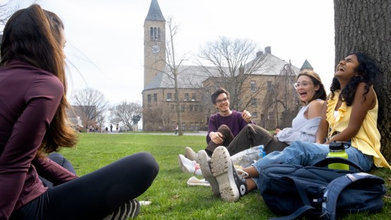 Students enjoy a warm spring day on the Arts Quad.