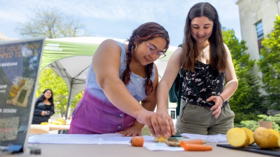 Students gather outside Mann Library in the Ag Quad to create their own textile prints using vegetables.