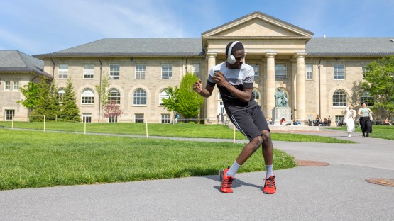 Student feels like dancing on the Arts Quad.