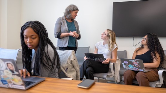 Visiting students work with Kelly Musick during NextGenPop.